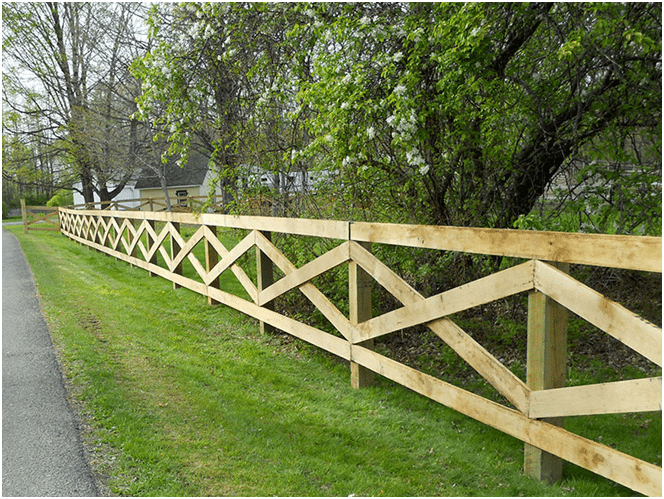 Farmhouse-Style Wooden Fence with X-Shaped Panels.