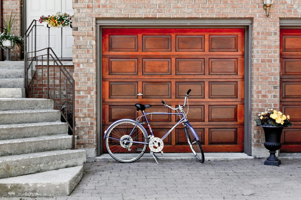 <p>Ever think of how much your garage impacts the overall look of your house? Turns out, a garage is more than just a practical utility — it is a key element of a home’s aesthetic charm. That big door takes up a lot of space and seriously affects how your humble abode looks from the street.</p>
<p>How exactly does your garage affect your curb appeal? Learn more about the impact and how you can enhance your home’s exterior charm.</p>
<h2><strong>Makes First Impressions Matter</strong></h2>
<p>The garage door is one of the first things people see when they look at your house. Its design, style and condition immediately catch the eye of visitors coming to your home or passers-by on the street.</p>
<p>Imagine you’re holding a house viewing and getting substantial bookings from prospects. But more than one arrives at your driveway, parks for a minute or two, and then drives away without a word. One who does walk into the house says, “The paintwork is impressive, and the lush landscaping is spectacular. But that garage could use some love.”</p>
<p>A dented, faded or peeling garage door drags down the visual appeal of your home. Buyers will interpret this as a sign of neglect. This mindset might extend to the rest of the property, negatively affecting the consumer’s decision.</p>
<p>Conversely, a freshly painted, well-maintained, stylish garage projects a sense of care and pride in home ownership which be more likely to attract high-potential buyers.</p>
<h2><strong>Boosts Home Value</strong></h2>
<p>Most real estate agents recommend that homeowners looking to sell optimize their curb appeal before listing. Buyers are increasingly showing a preference for properties with well-kept outdoor features. It suggests the homeowner has taken care of the property and is likely to have done the same with the interior.</p>
<p>The garage door in particular was found to be one of the most valuable home renovations by the Cost vs. Value Report <a href="https://www.aladdindoors.com/curb-appeal-is-vital-when-selling-your-home-during-the-pandemic/">with a 95% ROI (return on investment)</a>, suggesting that every $1,000 spent will result in a $950 increase in home value.</p>
<p>Houses with good curb appeal sell faster and often for more money. The buyer has peace of mind and will often be more willing to pay the asking price for a property. Think of it as a smart investment — one that may bring a bigger return down the line.</p>
<h2><strong>Complements Your Home Exterior Decor</strong></h2>
<p>Curb appeal is all about how your house looks from the outside. An attractive garage can harmonize with the home’s existing elements or stand out as a statement piece. It is the perfect embodiment of purposeful design.</p>
<p>For instance, a carriage house-style door with a woodgrain finish would enhance the curb appeal of a Victorian home, while a classic raised-panel door in a timeless color like white or black would suit a colonial house.</p>
<p>By choosing a garage door <a href="https://modded.com/cars/5-cheap-garage-renovation-tips-for-a-money-smart-makeover/">that reflects your home’s style</a>, you create a harmonious exterior that enhances your home’s overall aesthetic. You should also consider the color of your siding and front door so you can paint the door in a hue that brings balance. It makes your home come across as more appealing and put-together.</p>
<h2><strong>Make Your Garage a Curb Appeal Superstar</strong></h2>
<p>Your garage plays a vital role in curb appeal. With a little TLC, it can transform from an eyesore to an eye-catcher. Making thoughtful improvements and maintaining them well can significantly boost your home’s overall look and value.</p>
<p>Consider working with a credible exterior designer if your budget allows it. Whether you’re renovating for yourself or preparing to sell, investing in your garage’s appearance pays off in more ways than one. So, what are you waiting for? Get started today!</p>
<p> </p>
<p><strong>Author Bio</strong></p>
Complements Your Home Exterior Decor
